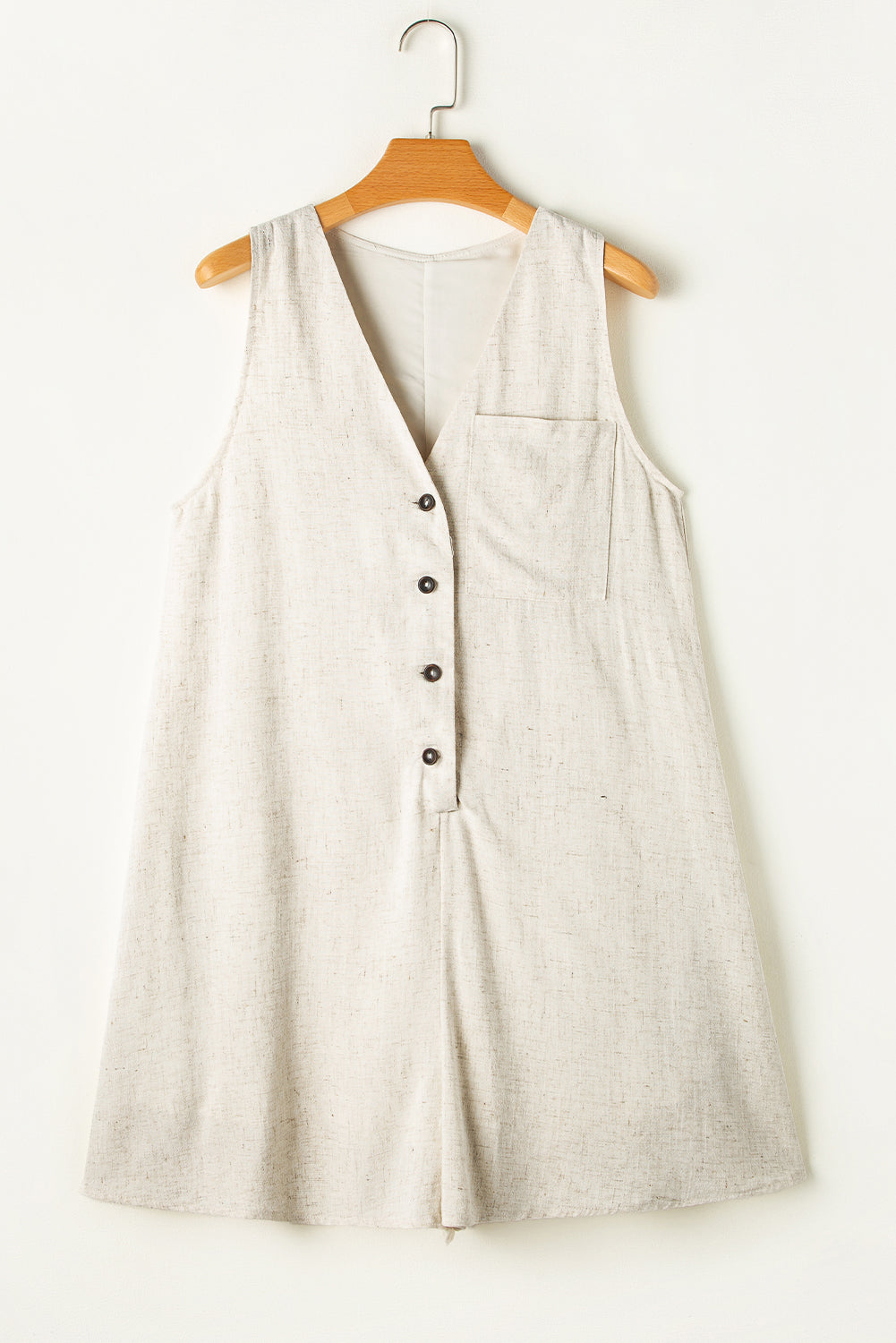 Beige V Neck Buttoned Front Chest Pocket Sleeveless RomperMaterial:92%Viscose+8%Linen

• Effortlessly chic, this romper exudes casual sophistication with its plain design and convenient chest pocket, perfect for a day out 