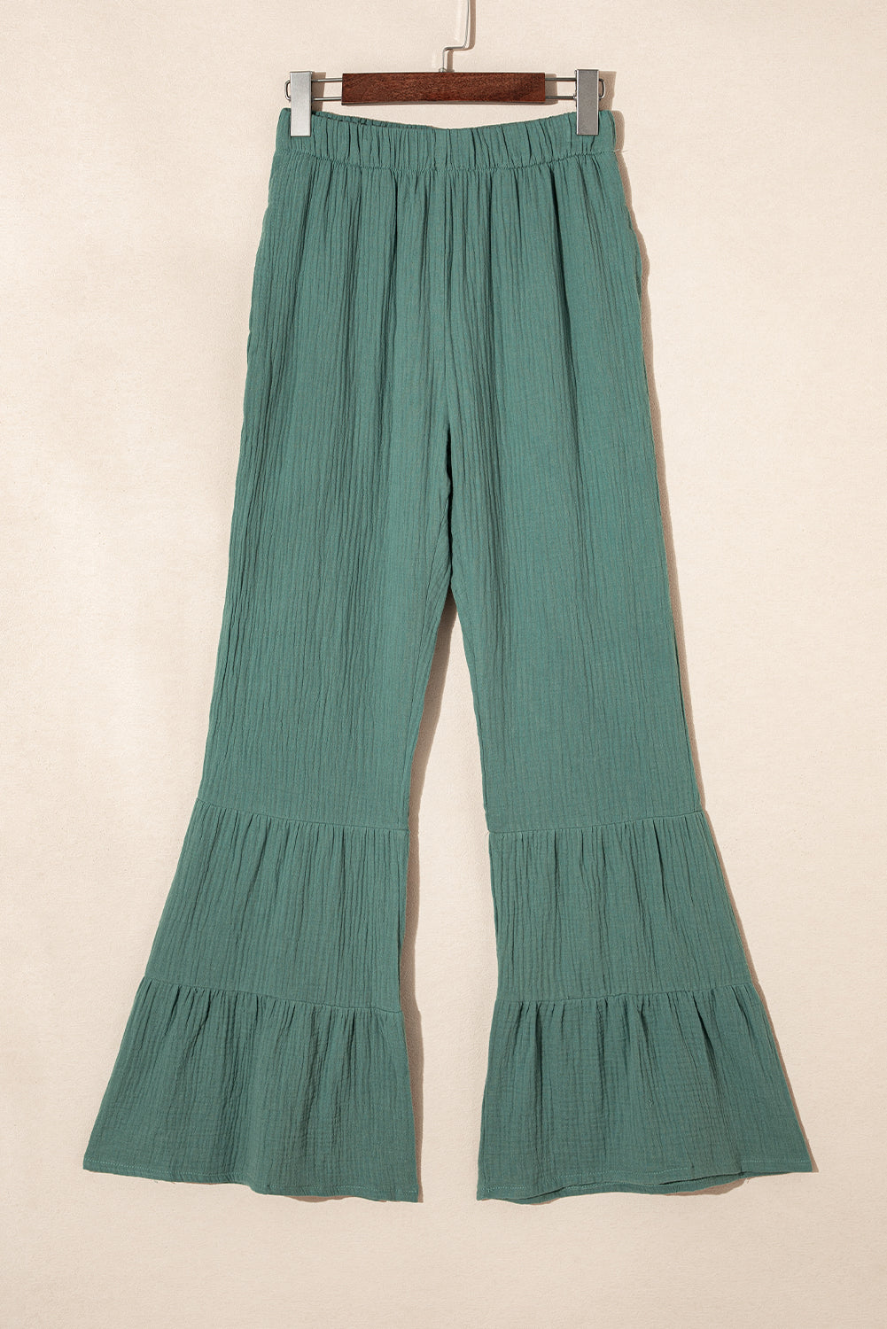 Black Plain Cotton Tiered Ruffle Flare High Waisted PantsMaterial:100%Cotton


	


		The vibrant green color adds a pop of color to your outfit, while the ruffle detailing brings a touch of femininity and flair.
	
	
