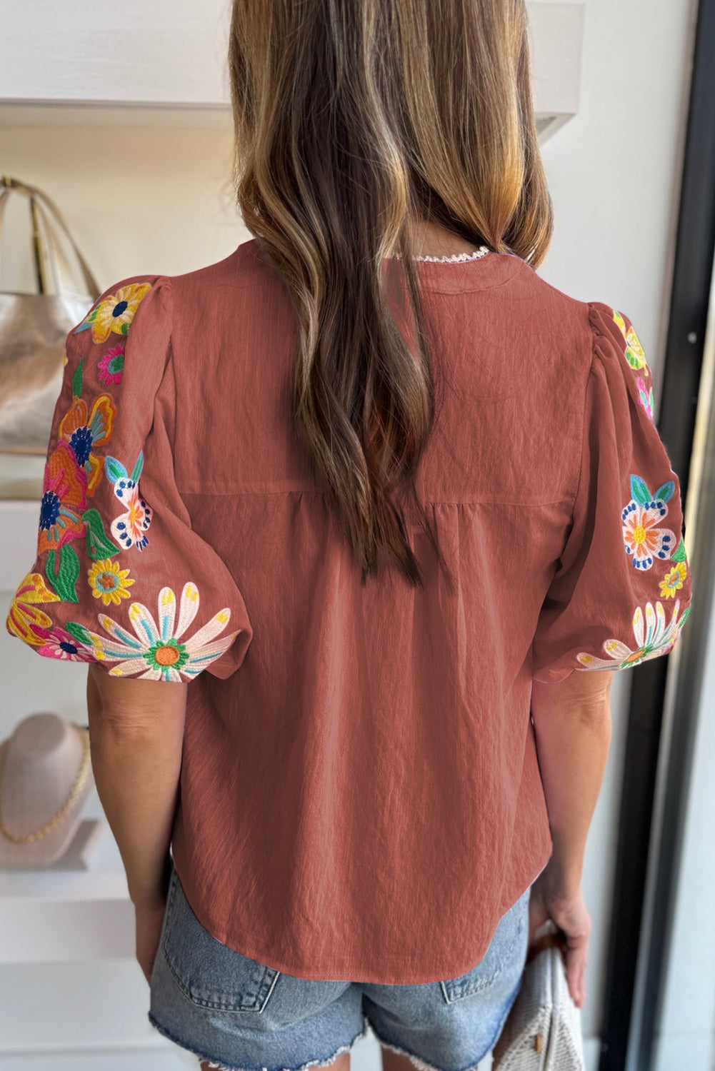 Mineral Red Floral Embroidered Puff Sleeve Split Neck BlouseMaterial:100%Cotton

• Radiate bohemian charm with the Mineral Red blouse featuring intricate floral embroidery and puff sleeves, perfect for a free-spirited look.
