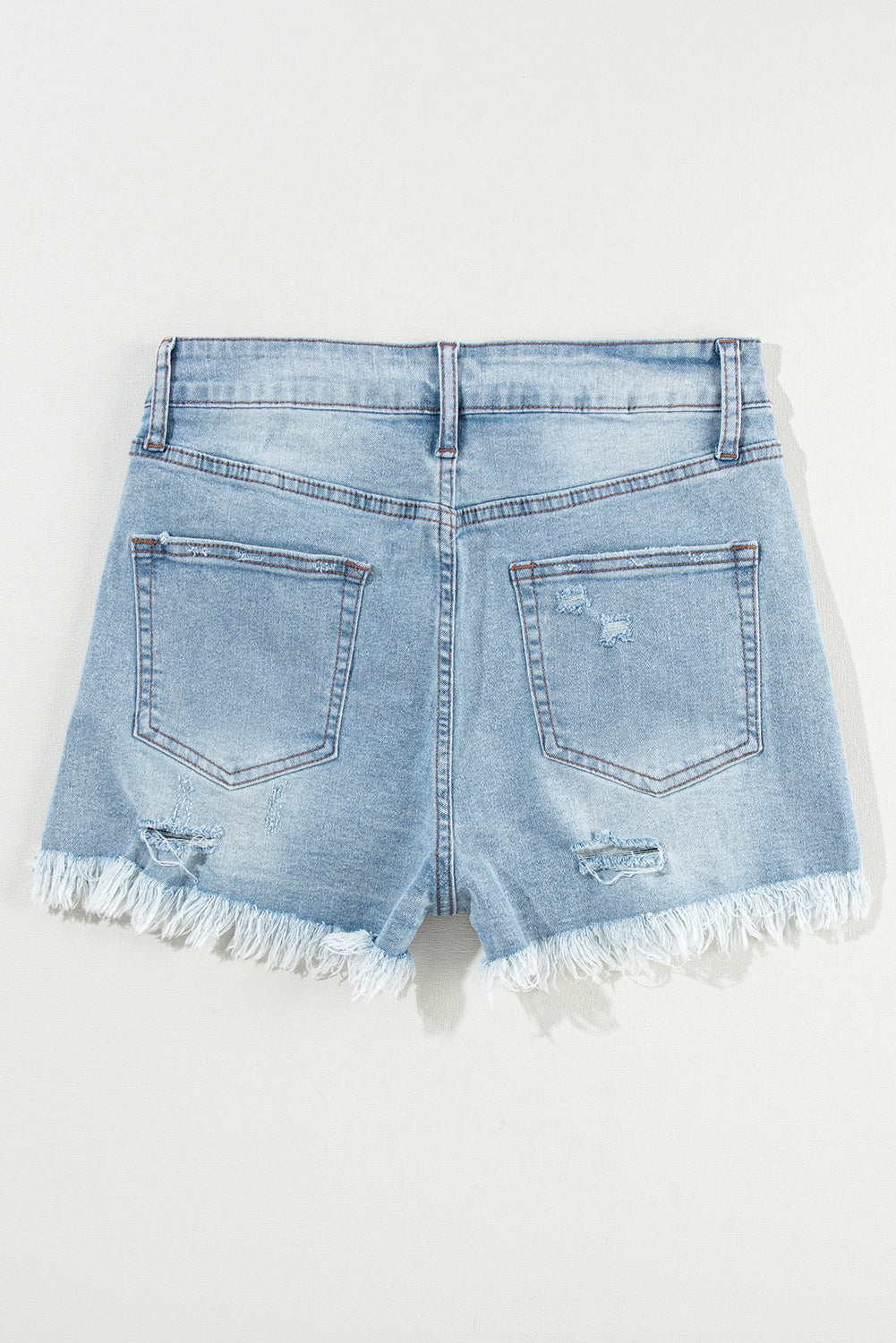 Light Blue Distressed Ripped Raw Hem High Waist Denim ShortsMaterial:55%Cotton+42%Viscose+3%Elastane

• The vintage wash gives them a classic look, while the high waist design ensures a flattering fit.
• Featuring practical